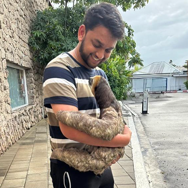 Siddhart holding a sloth